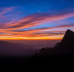 image of sunset kolukkumalai tent stay